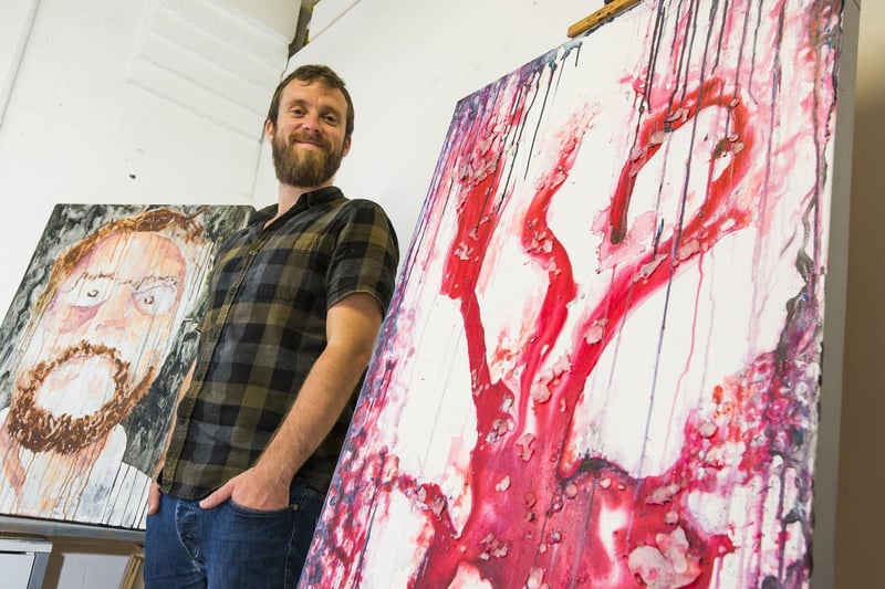 Alex Harwood with his work at Northlight Art Studios.