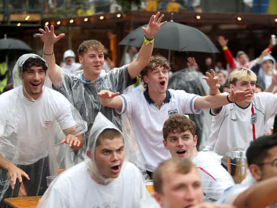 The threat of rain is not dampening the spirits of any football fan tonight.
Picture PA Wire