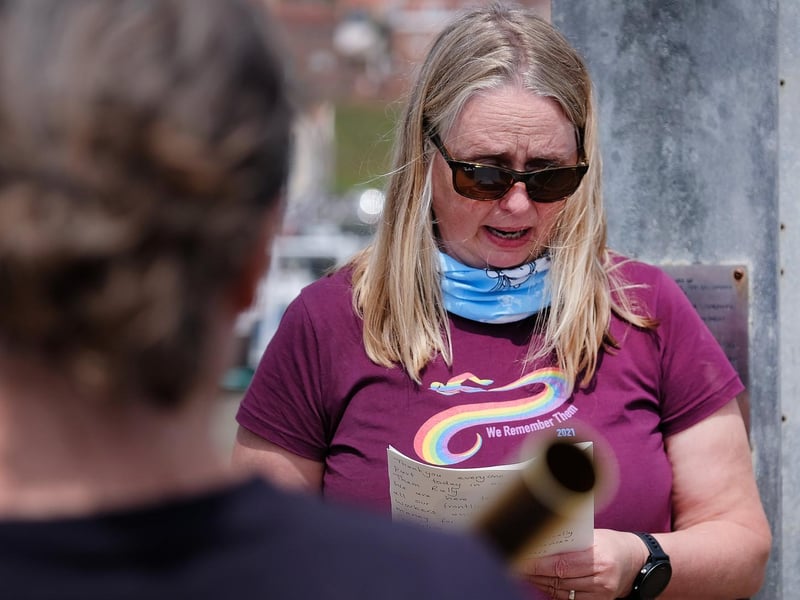 Organiser Caroline Powell recites a reading to the gathering.