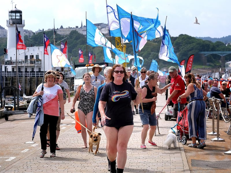 The march commences along the harbour.