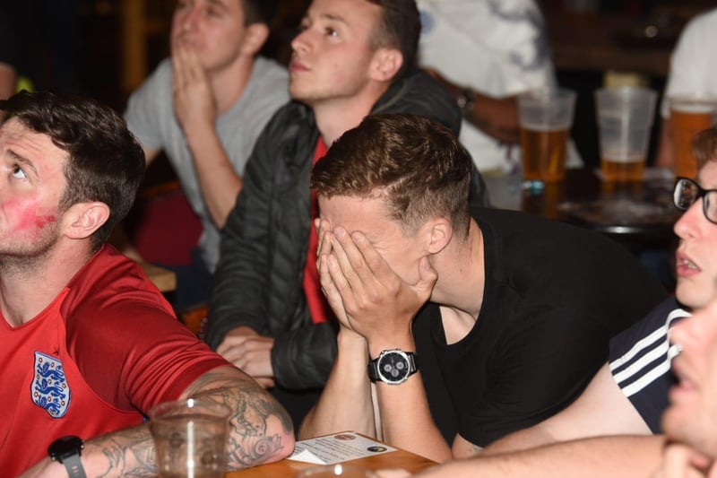Not our night - fans in Wigan react to the penalty shoot-out in the Euros final