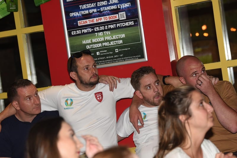 Not our night - fans in Wigan react to the penalty shoot-out in the Euros final