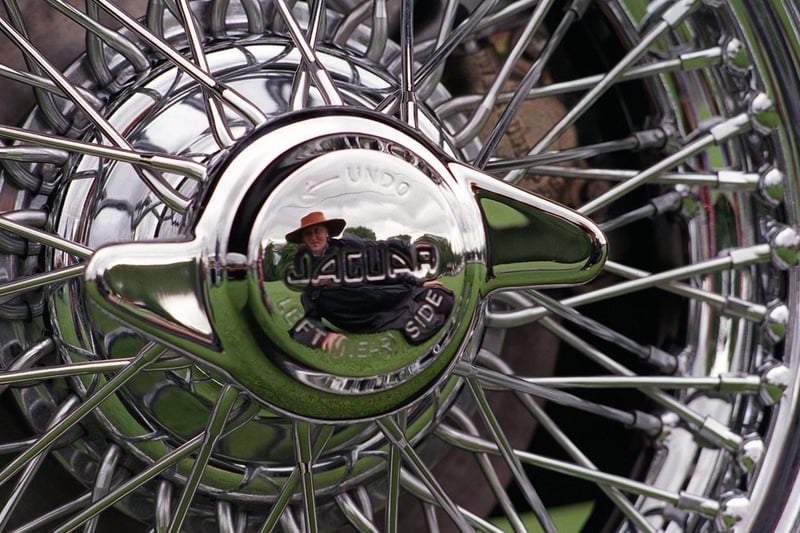 More than 1,000 cars took part in a Jaguar Car Rally at Harewood House. Pictured is Nicola Dyson reflected in the silver wheel hub of a Jaguar MK2.