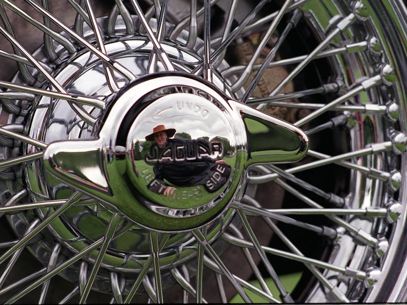 More than 1,000 cars took part in a Jaguar Car Rally at Harewood House. Pictured is Nicola Dyson reflected in the silver wheel hub of a Jaguar MK2.