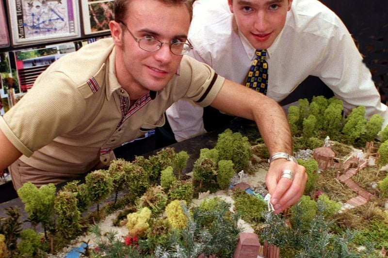 Leeds Metropolitan University graduates Steve Heywood (left) and Adrian Parr with a model of a fantasy adventure trail they designed for Martin House Hospice.