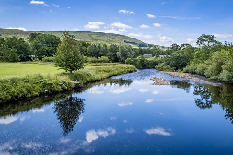 The River Ure, just outside Hawes, reflecting the stunning blue sky