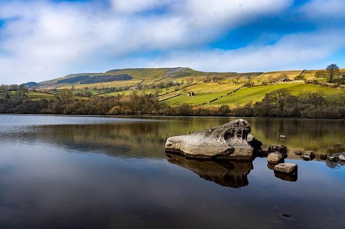The beautiful Mermaid Rocks of Semerwater lake the second largest natural lake in North Yorkshire, after Malham Tarn. The lake is half a mile long, covers 100 acres and lies in Raydale, opposite the River Bain.
