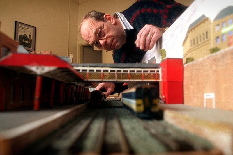 March 1997 and cCub secretary, Ian Holmes, puts the finishing touches to model of Dewsbury Station for the Dewsbury and District Annual Model Railway Fair.