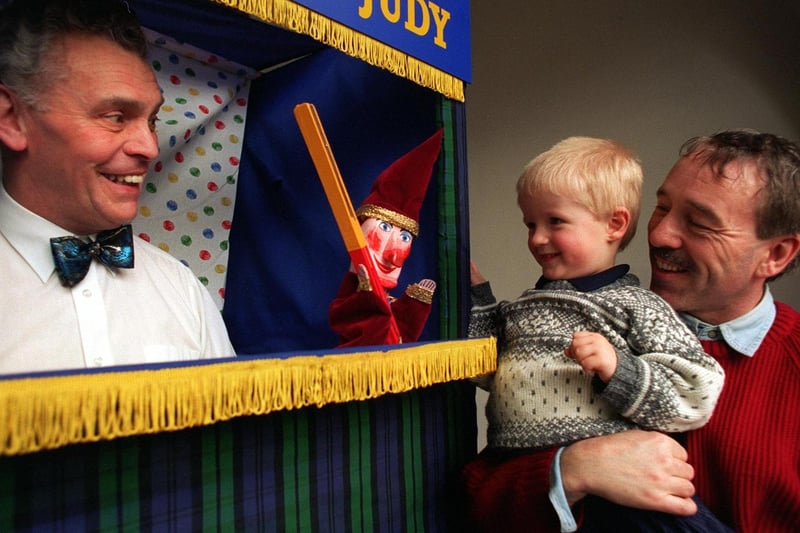 Young Jack Mitchell and his granddad Steve Mitchell enjoy the Punch and Judy Show given by Mr Gully at Abbey House Museum in February 1997.