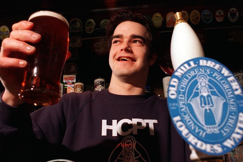 Ian McGoverin, landlord at The Beer Street pub with a pint of Lourdes Water, which had been brewed to raise funds for the Handicapped Childrens Pilgrimage Trust.