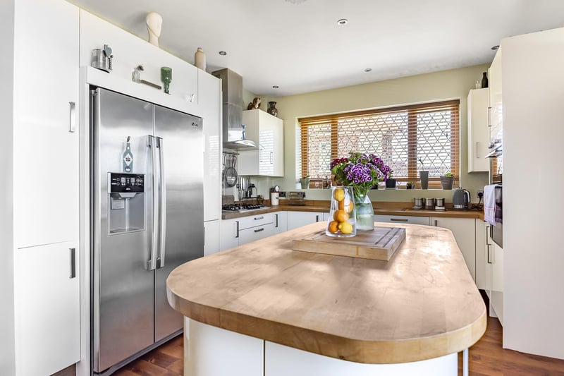 A bright and modern kitchen with plenty of storage and worktop space