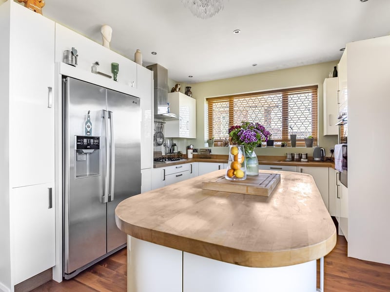 A bright and modern kitchen with plenty of storage and worktop space
