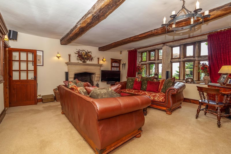 Beams, stunning fireplaces and mullion windows add warmth and character