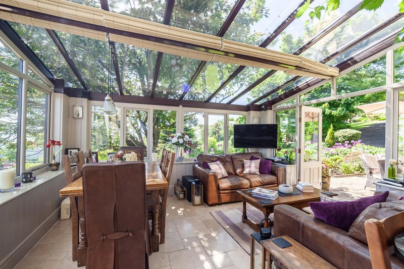 A conservatory opening out to a patio area