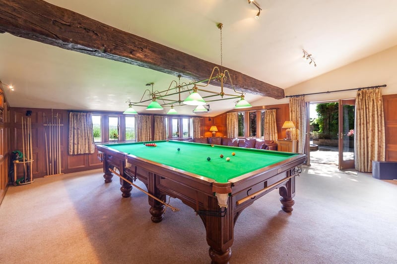 A snooker table is currently in place within the games room