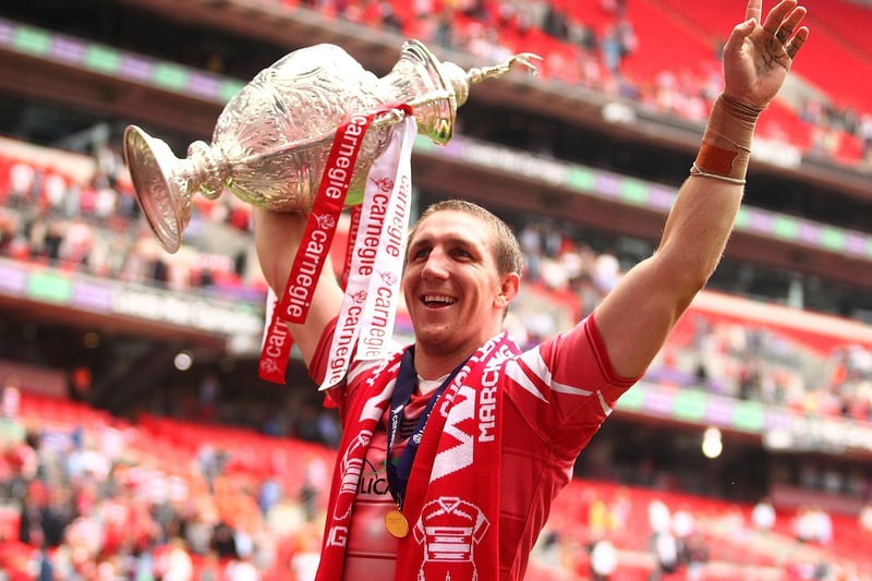 2011 - Ryan Hoffman of Wigan Warriors celebrates by lifting the Carnegie Cup following the Carnegie Challenge Cup Final between Leeds Rhinos and Wigan Warriors at Wembley Stadium on August 27, 2011.