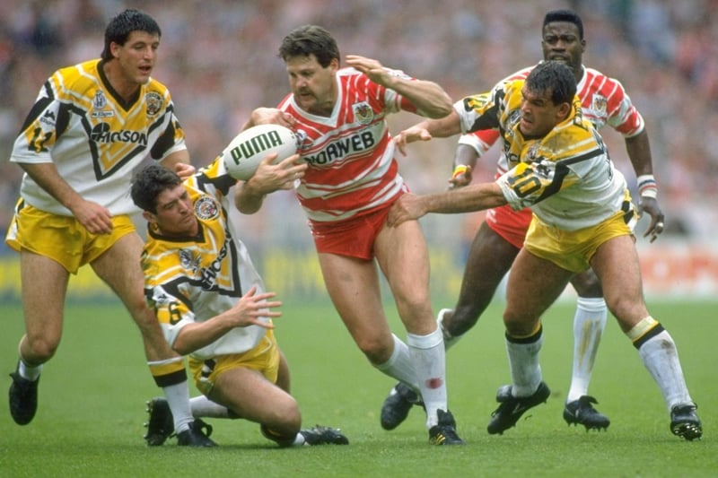 1992:  Gene Miles (centre) of Wigan is tackled by Keith England (right) of Castleford during the Challenge Cup final at Wembley Stadium in London - Wigan won the match 28-12.