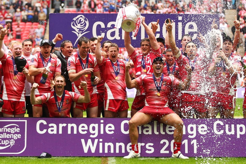 2011 - Wigan Warriors players celebrate with the Carnegie Cup after victory over Leeds Rhinos following the Carnegie Challenge Cup Final 2011, between Leeds Rhinos and Wigan Warriors at Wembley Stadium.