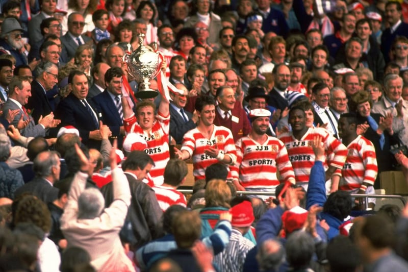 1988:  Shaun Edwards of Wigan lifts the trophy aloft after their victory in the Silk Cut Challenge Cup final against Halifax at Wembley Stadium in London. Wigan won the match 32-12.