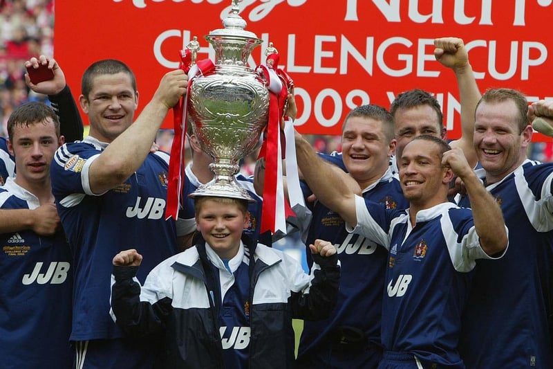 2002:  Andrew Farrell of Wigan celebrates with the team and his son Owen Farrell after winning the St Helens v Wigan Warriors - Kelloggs Nutri Grain Challenge Cup Final from Murrayfield, Edinburgh.