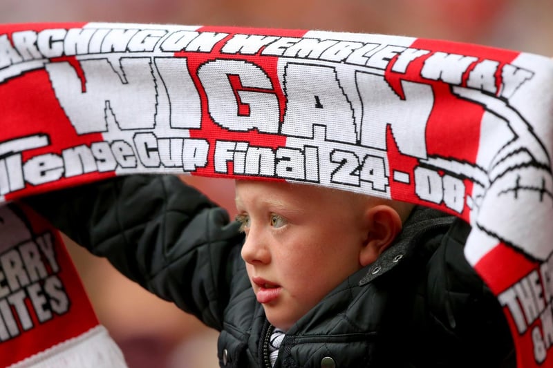LONDON, ENGLAND - AUGUST 24:  A young Wigan fan shows his support during the Tetley's Challenge Cup Final between Wigan Warriors and Hull FC at Wembley Stadium on August 24, 2013 in London, England.