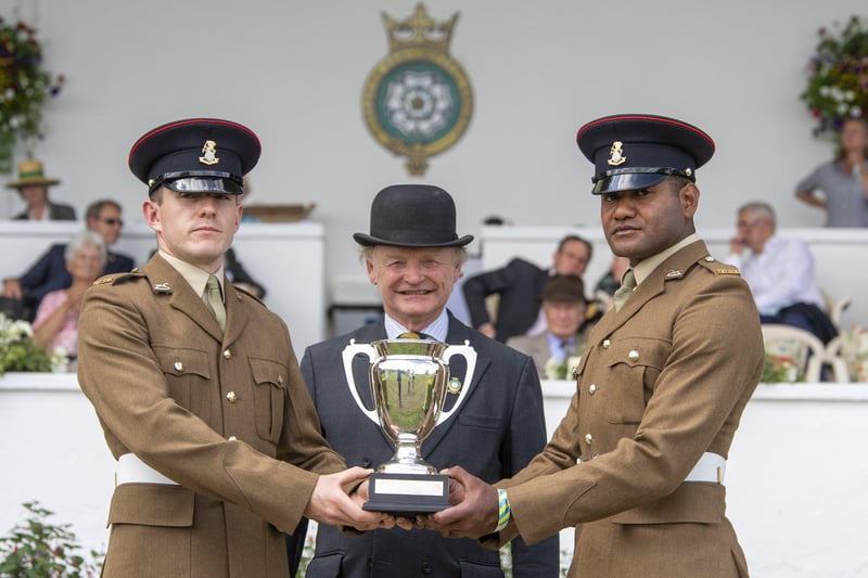 14 July 2021.....   Great Yorkshire Show Day 2 Wednesday.
Simon Theakston presents Private Morgan Harridence 2020 Private Freddie  Work 2021 the Soldier of the Year award for the Yorkshire regiment. Picture Tony Johnson