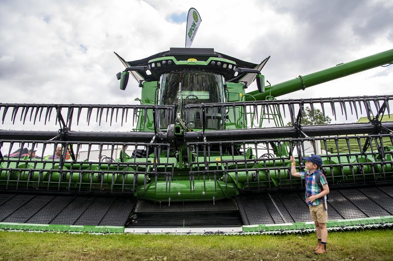 14 July 2021.....   Great Yorkshire Show Day 2 Wednesday.
William Stockwell 6, looks at the worlds combine harvester. Picture Tony Johnson