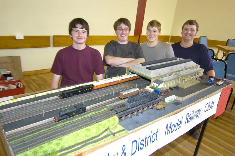 Whitby & District Model Railway Club members with a 1940s model of Whitby Train Station.