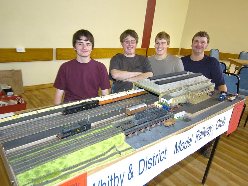 Whitby & District Model Railway Club members with a 1940s model of Whitby Train Station.