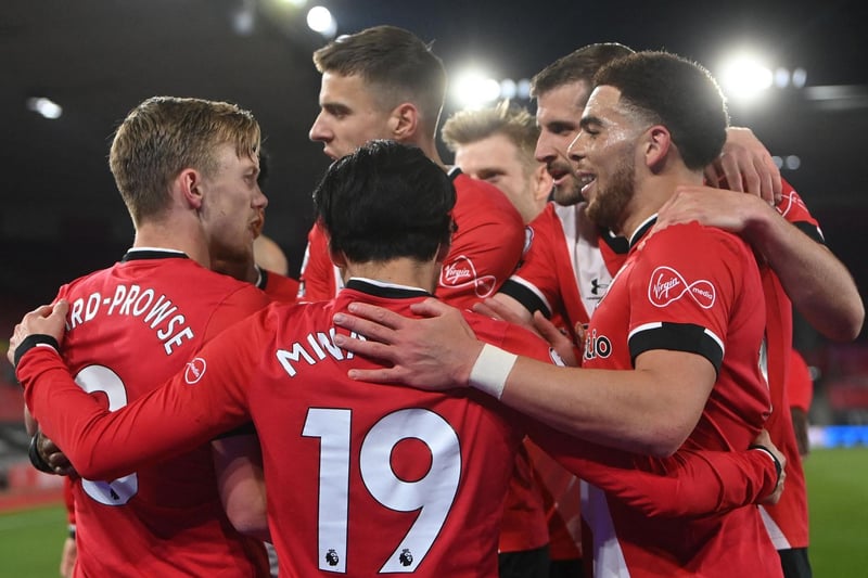 Southampton's English midfielder James Ward-Prowse (L) celebrates with teammates after scoring the opening goal from the penalty spot during the English Premier League football match against Leicester City at St Mary's Stadium in Southampton on April 30, 2021.