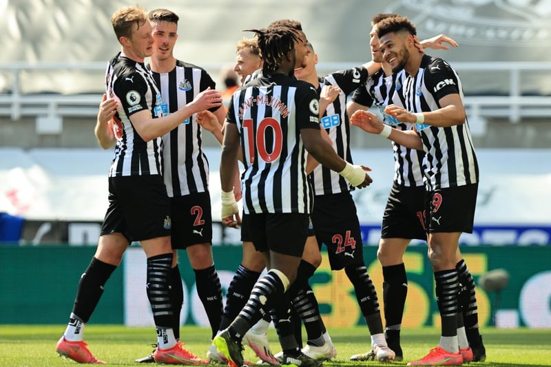 Joelinton of Newcastle United (R) celebrates with teammates after scoring their team's second goal during the Premier League match between Newcastle United and West Ham United at St. James Park on April 17, 2021 in Newcastle upon Tyne, England.