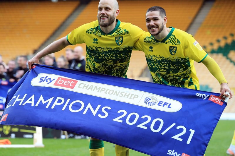 Teemu Pukki and Emiliano Buendia of Norwich City celebrate winning the Sky Bet Championship after the Sky Bet Championship match between Norwich City and Reading at Carrow Road on May 01, 2021 in Norwich, England.