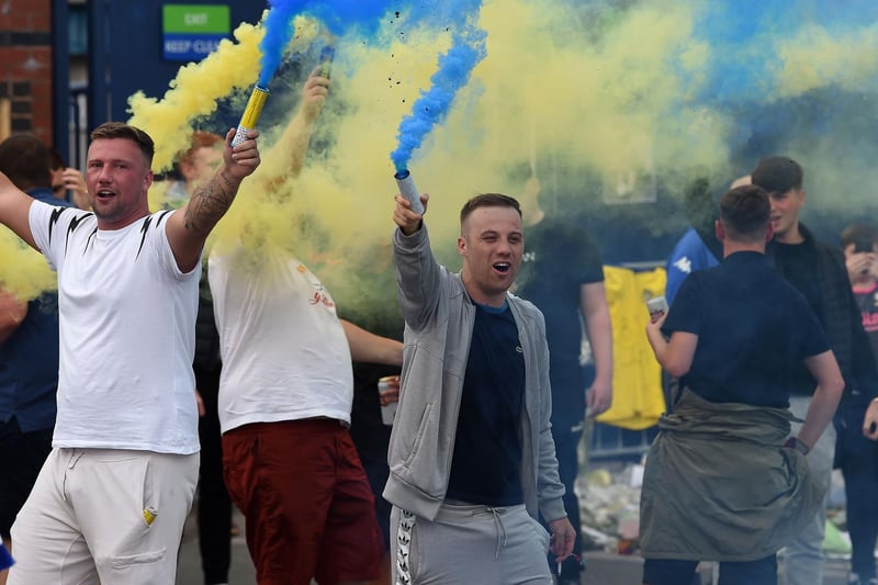 Fans hold flares during the promotion celebrations at Elland Road.