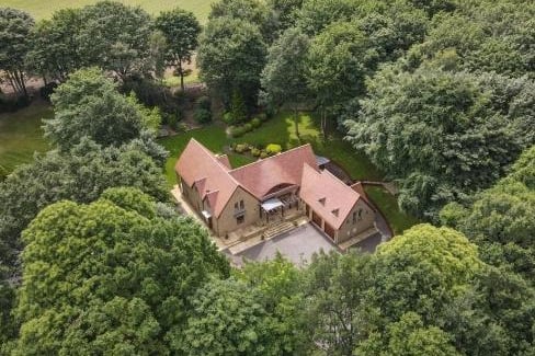 Externally the property is surrounded by extensive grounds, a delightful mixture of lawned areas and woodland gardens which offer a haven for local wildlife and provide the perfect setting for family gatherings and al-fresco dining.