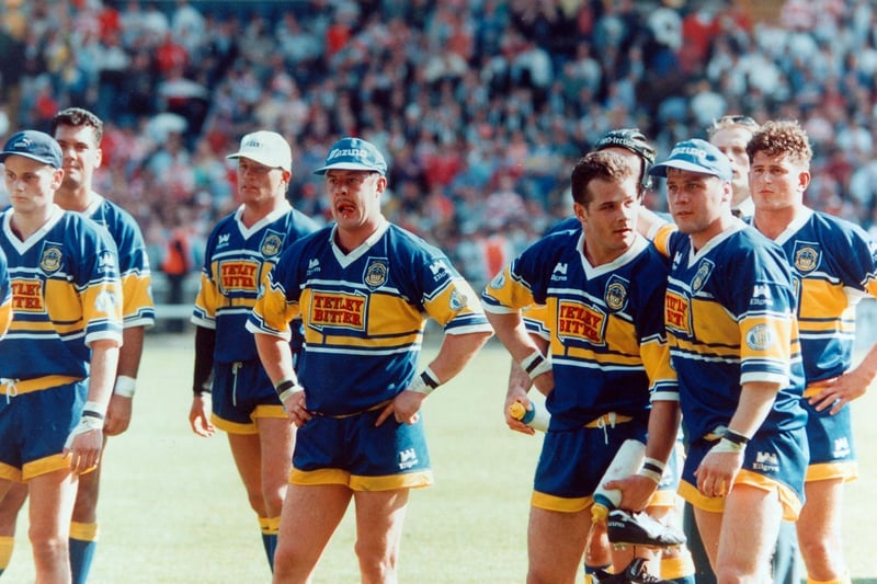 A disappointed Leeds RL team look on in stunned silence as Wigan head for the Royal Box to collect the Silk Cut Challenge Cup in May 1994.