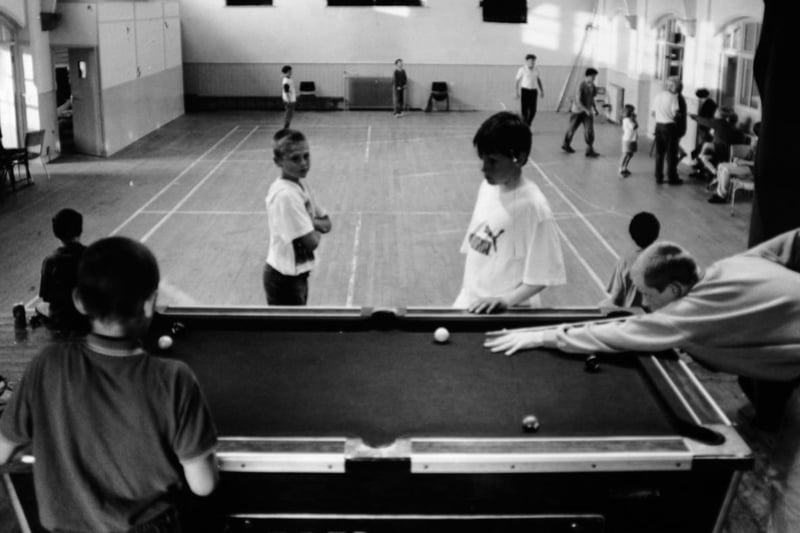 St. John's Church Hall in Farsley faced demolition in July 1994. Pictured are youngsters enjoying a game at the youth club.