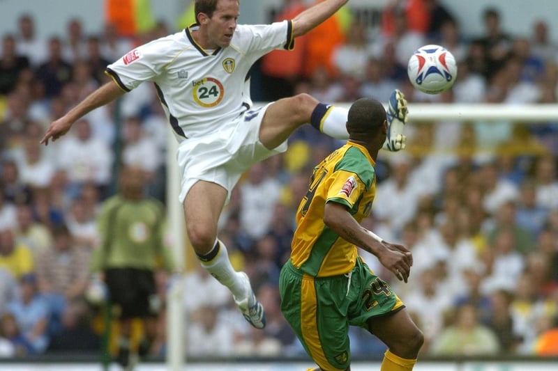 Eddie Lewis leaps for the ball in front of Norwich City's Jurgen Colin.