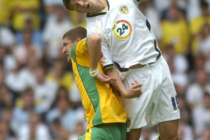 Eirik Bakke rises high to win the ball from Norwich City's Carl Robinson.