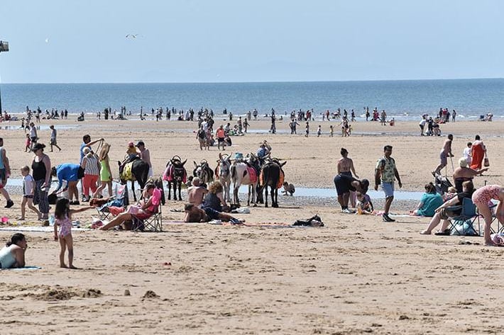 Records were set in both England and Wales on Sunday, and the mercury is forecast to climb even higher on Monday.