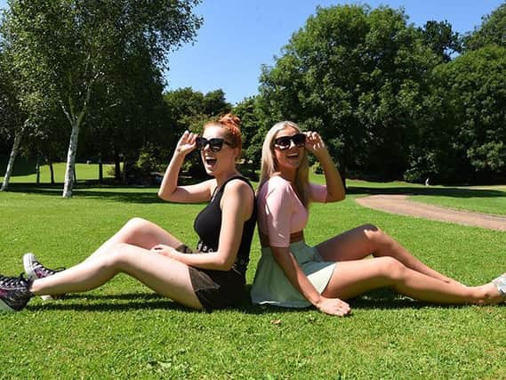 Melissa Littlechild and Ebony Gilmour have fun in the sun, pictured at Avenham Park, Preston.