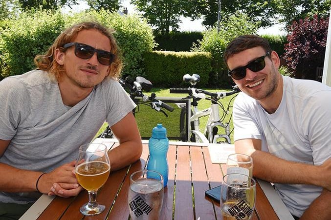 Brothers Greg and Matt Horsfall enjoy a beverage after cycling around Preston