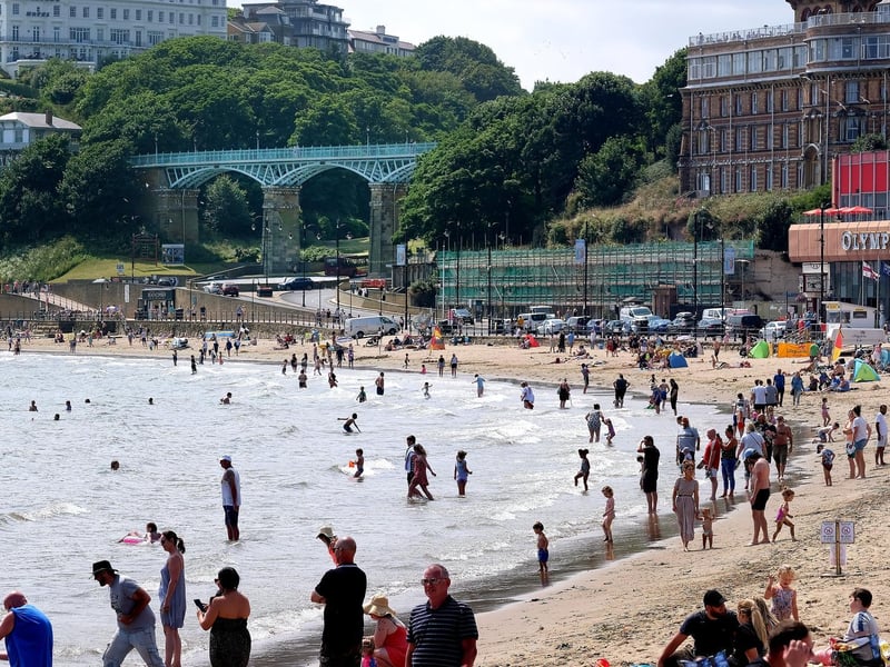 People were enjoying the sea during the hot weather.