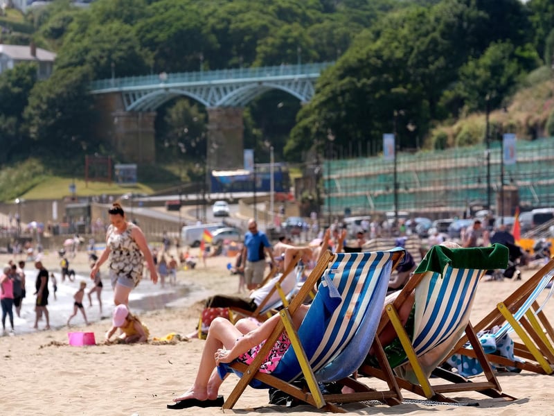 The sand was packed with people.