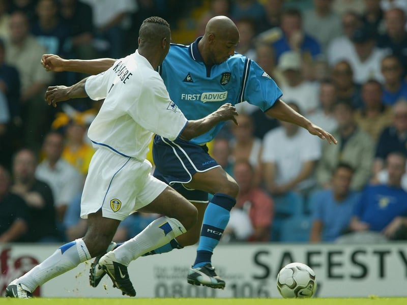 Lucas Radebe challenges Mancheaster City's Nicolas Anelka.