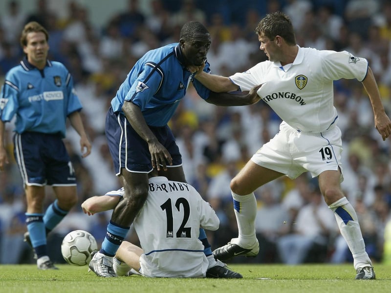 Eirik Bakke pulls Manchester City's Marc Vivien Foe's shirt as he trips over Nick Barmby.