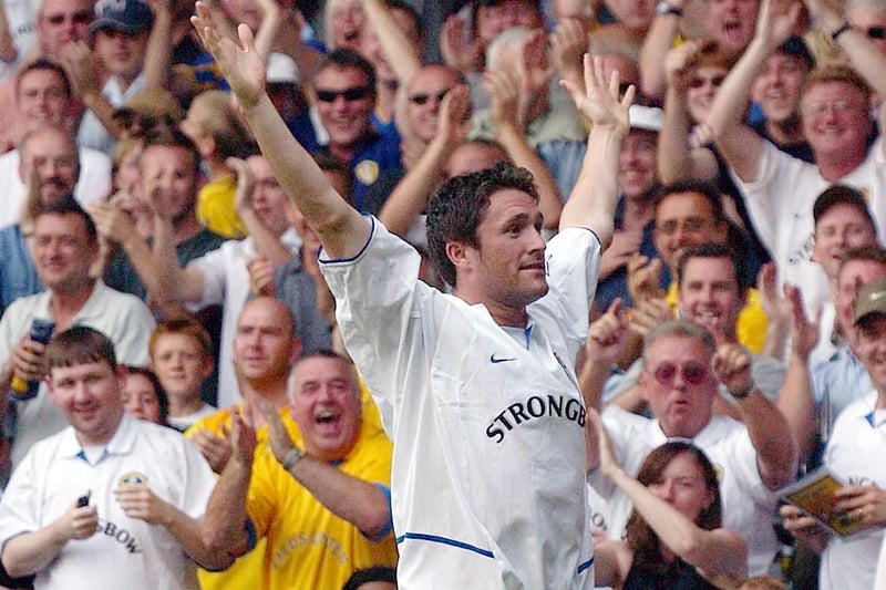 Substitute Robbie Fowler celebrates scoring Leeds United's third goal of the game after lobbing Carlo Nash.
