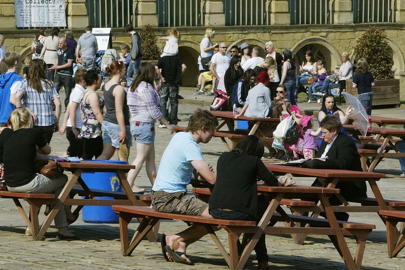 People enjoying the sunshine at the Piece Hall in 2011.