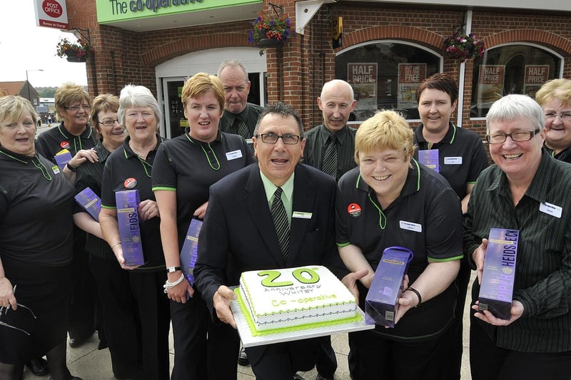 Whitby’s Co op celebrates with some of its staff serving 20 years.