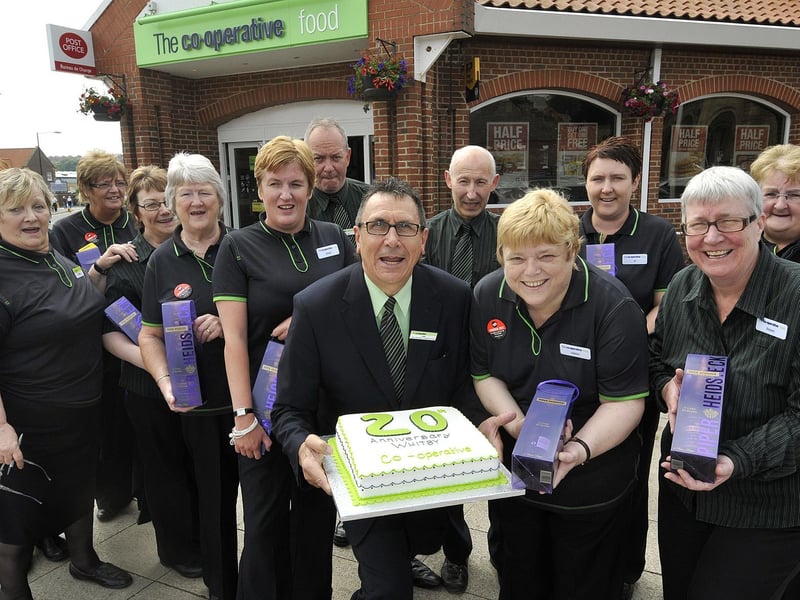 Whitby’s Co op celebrates with some of its staff serving 20 years.