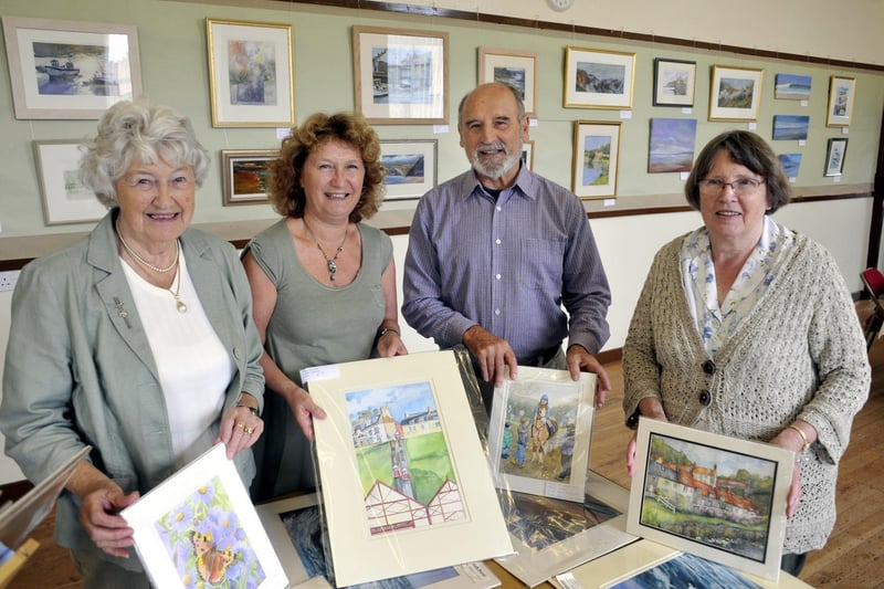 Artists and their work at the Hinderwell Gala Week Art Exhibition in the Old School.